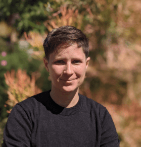 Dax Goldstein, short brown hair, in a black long sleeve shirt